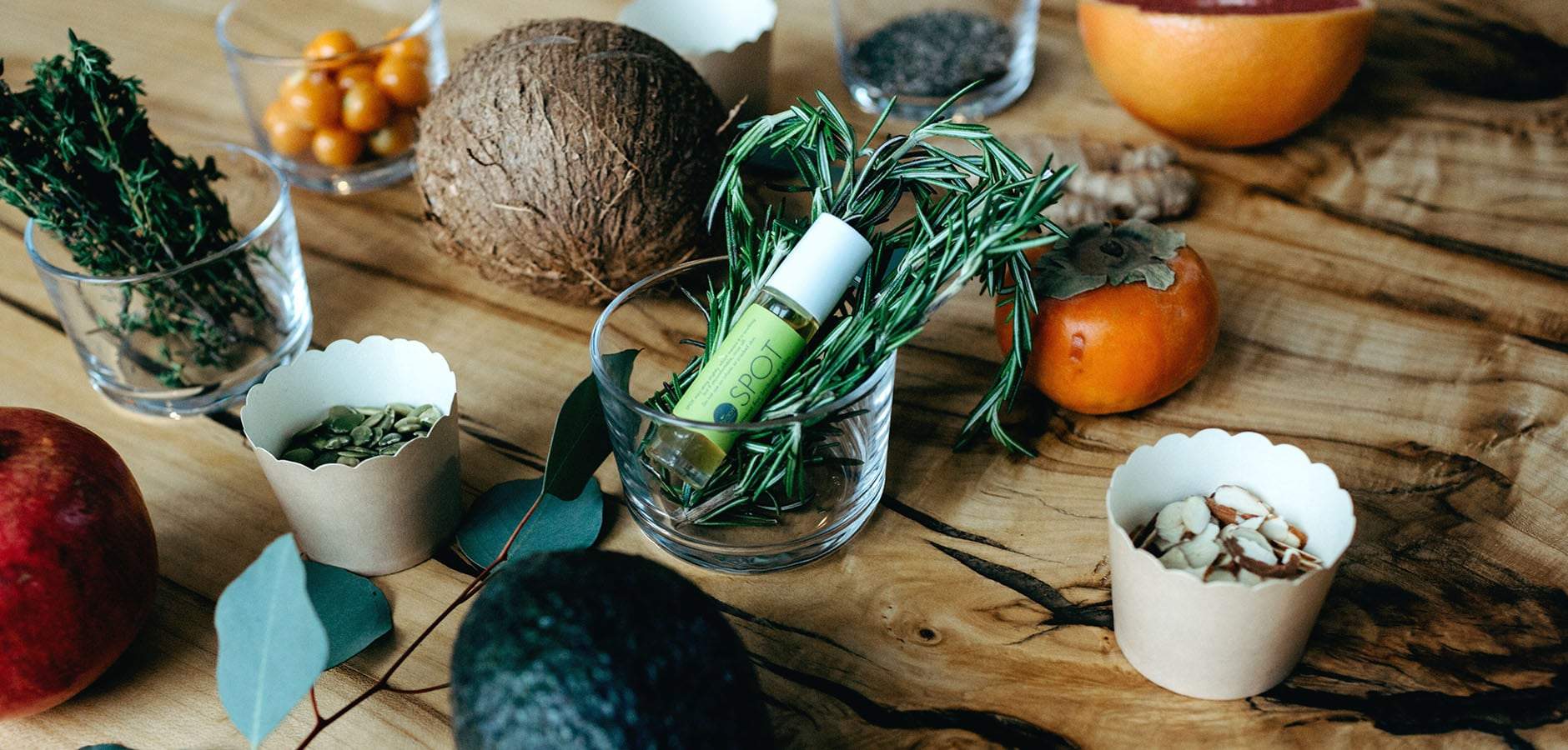 Our Spot product and its ingredients sitting on the kitchen table are safe & healthy topical treatment skin care remedies.