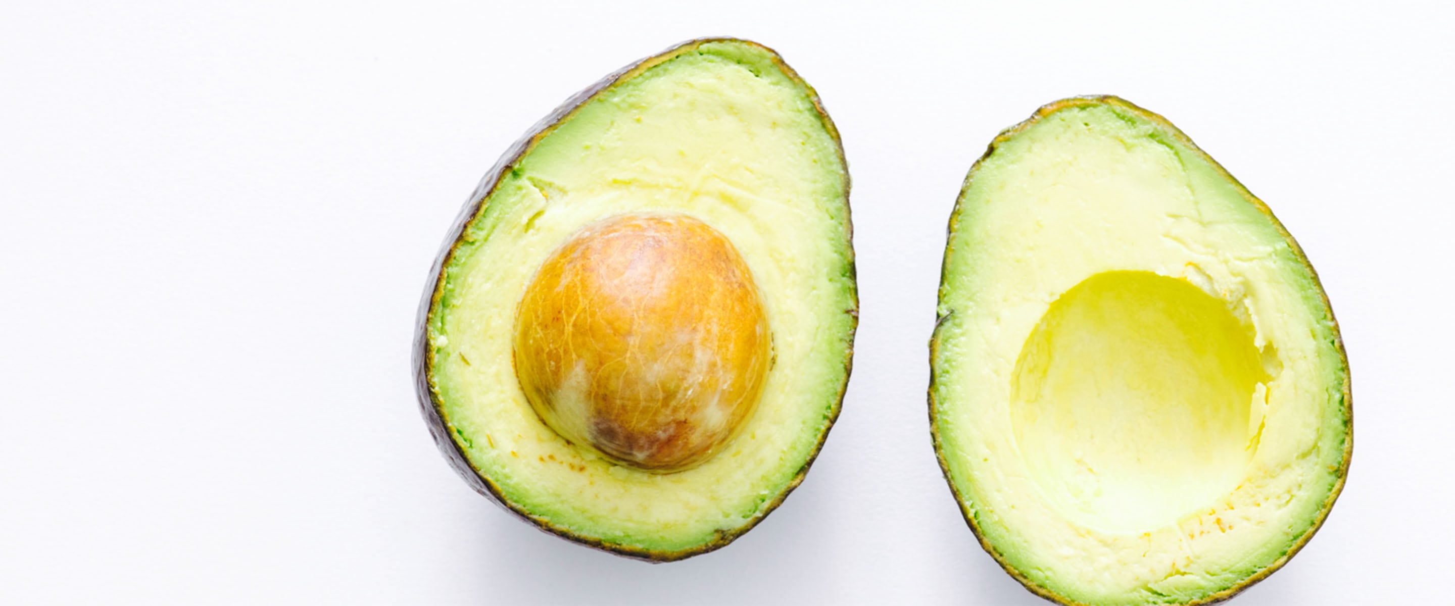 The oil in this sliced avocado on the table will help to moisturize, hydrate, cleanse, refresh and treat your skin.