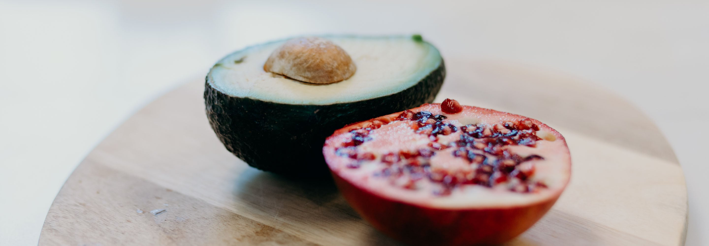 This avocado and pomegranate sitting on the stool will help in getting a great foundation for healthy skin . 