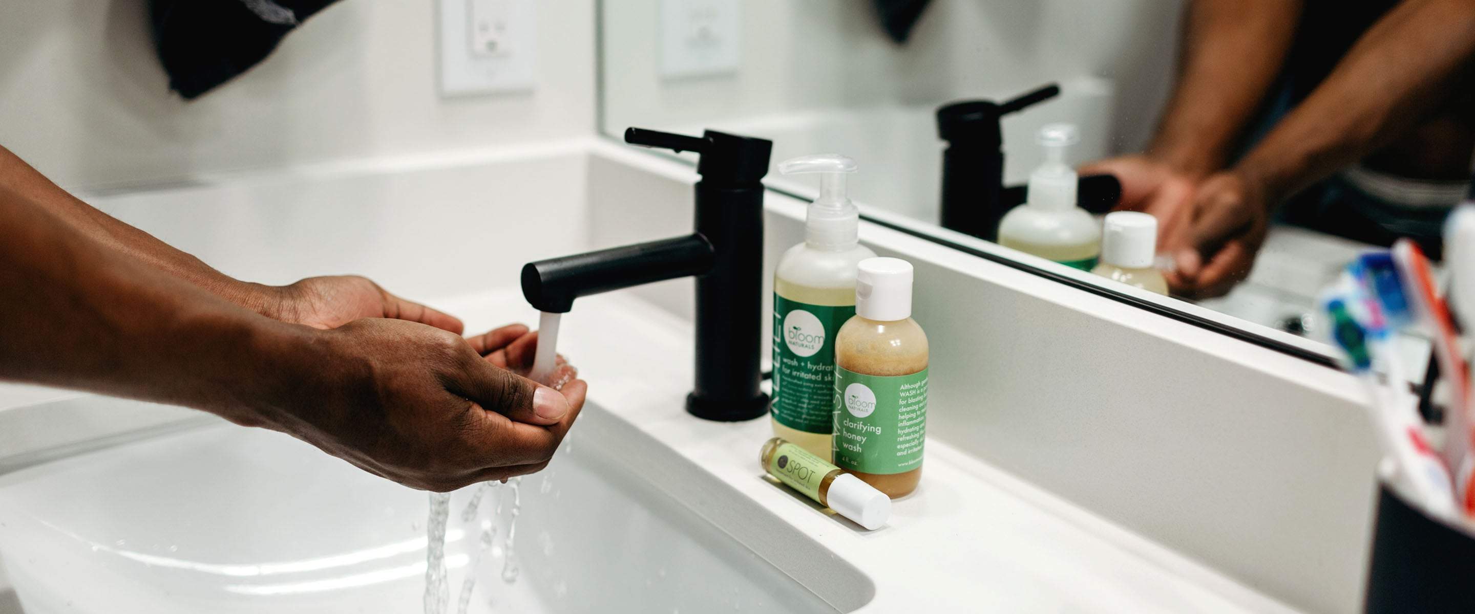 This man using the Cure-A system to clean, moisturize, protect and treat in the bathroom is taking charge of his skin!