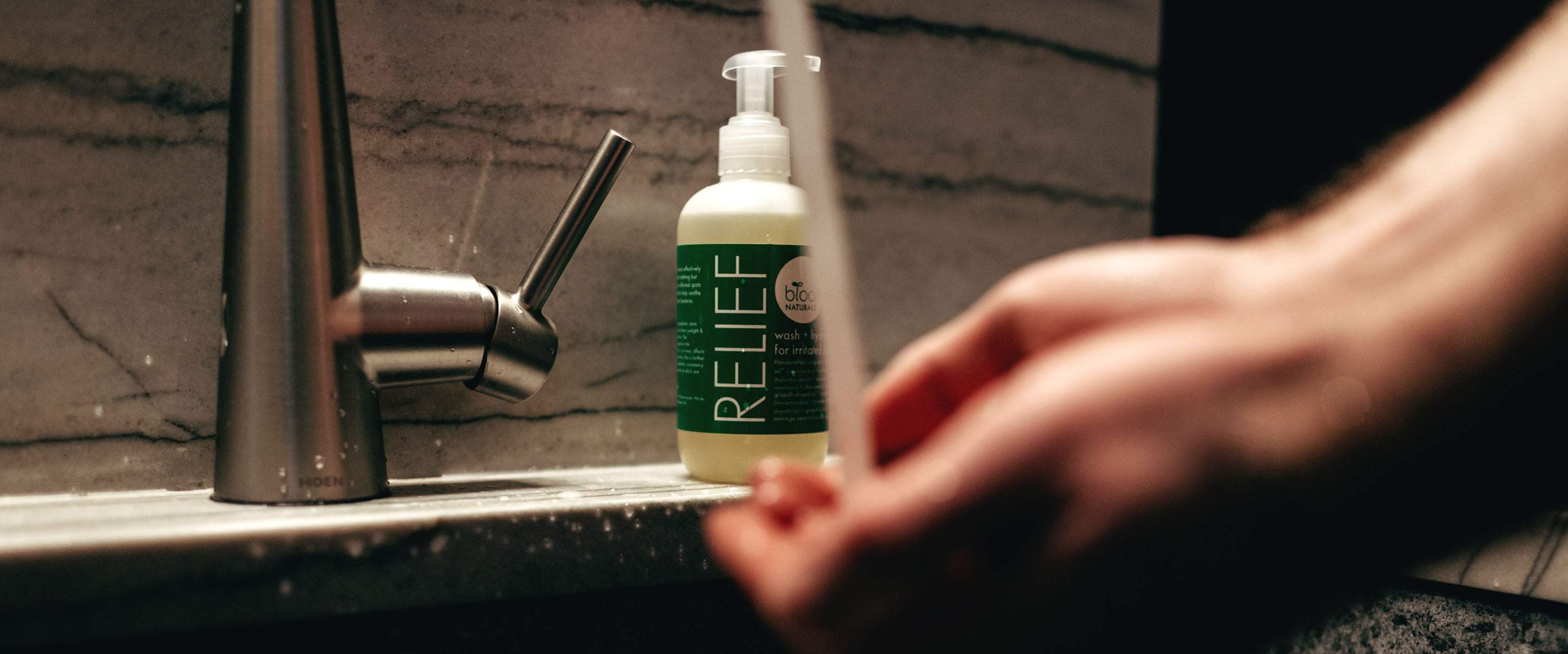 This man using body and face solution for men Relief product at his bathroom sink will soon get back to enjoying life.