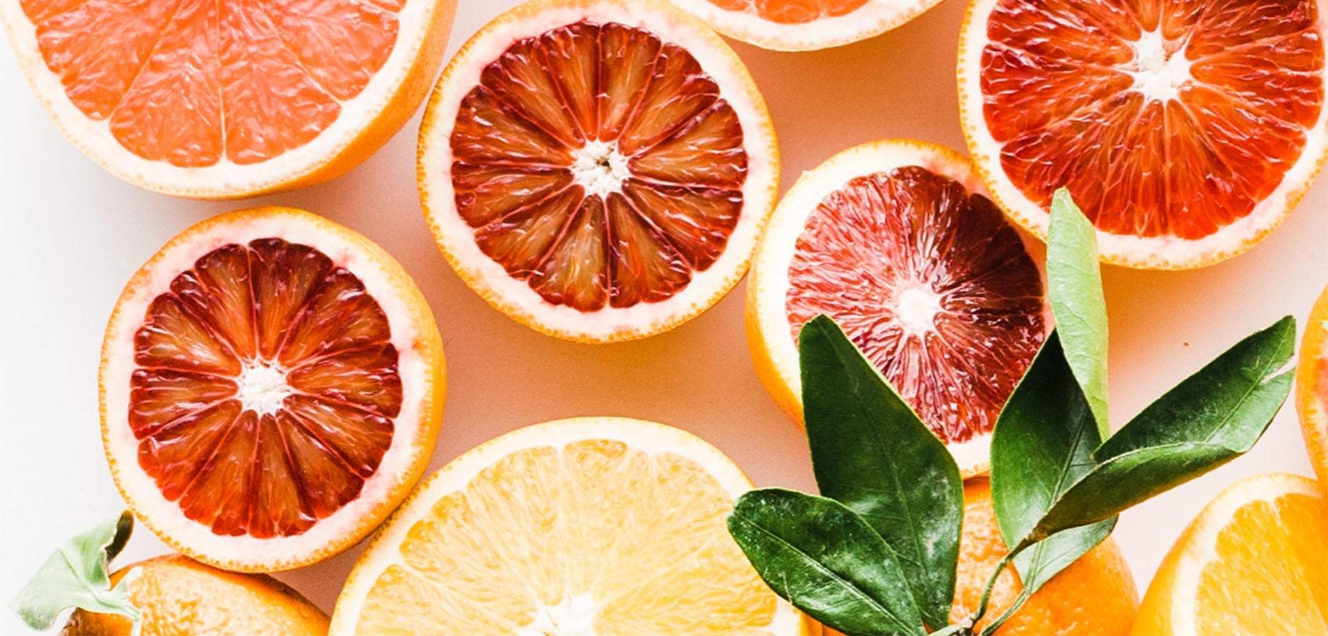 The oil from the grapefruit laying on this table will help to change your skin and clear up your mild eczema and face.